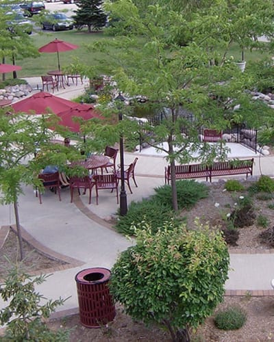 Outdoor seating area with tables and umbrellas