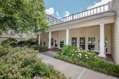 Outdoor garden area with seating and flowers