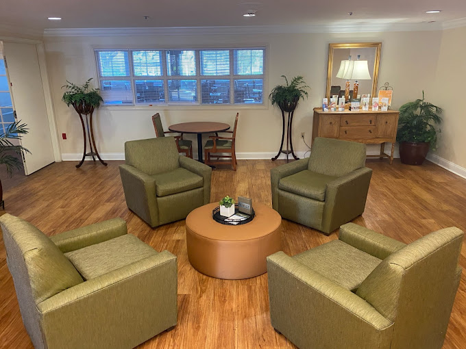 Common area with seating and tables for residents