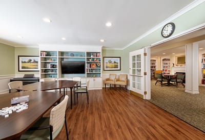 Bright and inviting common area with seating and shelves
