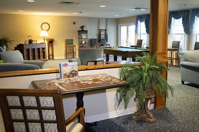 Interior common area with seating and a puzzle table