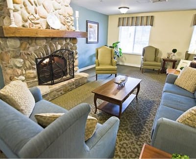 Cozy common area with a fireplace and seating