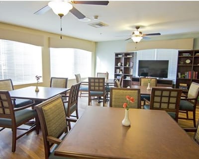 Bright common area with tables and chairs
