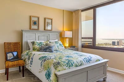 Bright, well-decorated resident bedroom with a view