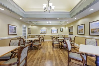 Bright dining area with wooden tables and chairs