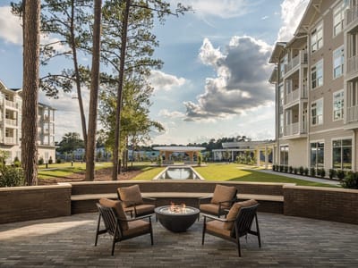 Outdoor seating area with a fire pit and landscaping