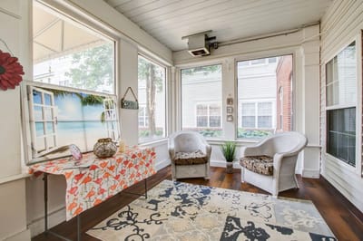 Bright common area with wicker chairs and decor