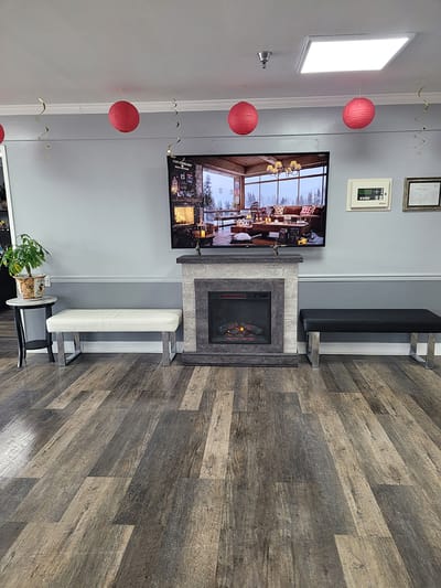 Common area with benches and a fireplace