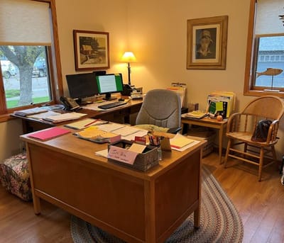 An office space with a desk and documents