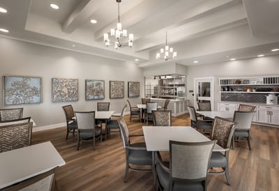Bright dining room with tables and chairs arranged