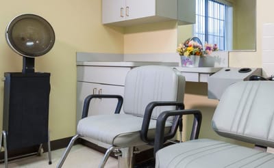 Hair salon area with styling chairs and equipment