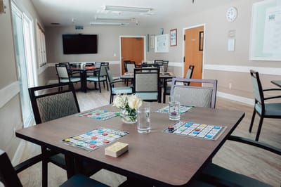 Bright activity room with bingo game setup