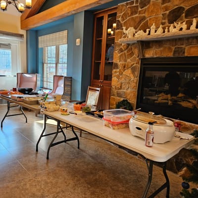 A dining setup with food displayed in a common area