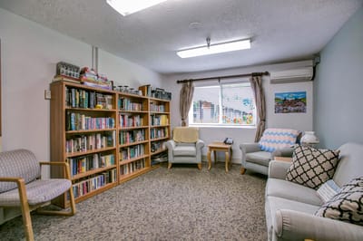 Common area with bookshelves and seating