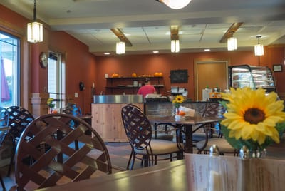 Interior view of a dining area with tables and a counter