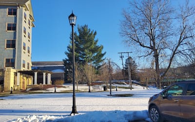 Exterior view of the Elmhurst House with snow and trees