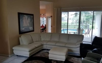 Interior view of a common area with seating and outdoor access