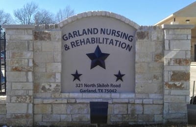 Facility sign displaying name and address