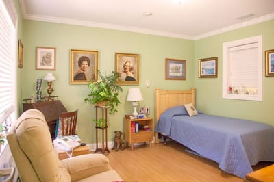 Cozy resident room with paintings and personal items