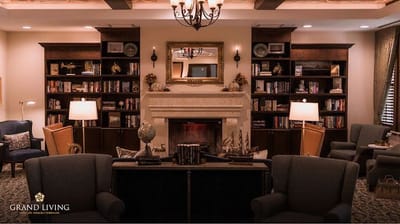 Cozy common area with bookshelves and comfortable seating