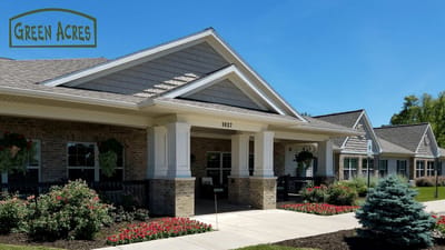 Exterior view of Green Acres facility with logo