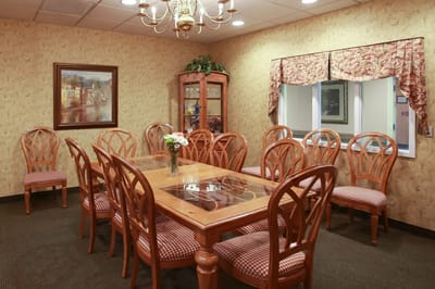 Interior common area with a large wooden table and chairs