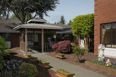 Garden path leading to a covered seating area