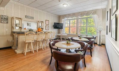 Bright common area with tables and chairs