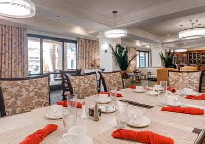 Dining room setup with tables and drinkware