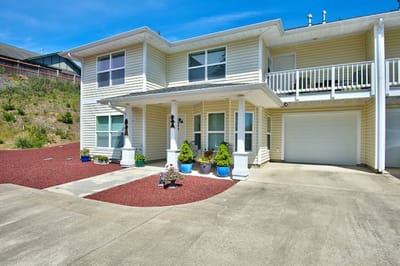Exterior view of a residential facility with landscaped area