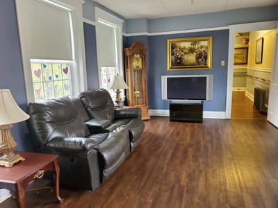 Cozy lounge area with seating and wall artwork