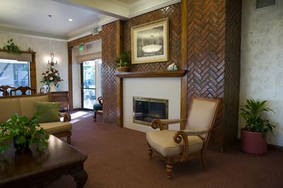 Well-furnished common area with a fireplace and seating