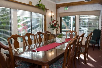 Dining room with a large table and floral decor