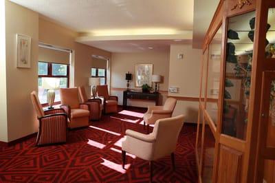 Bright common area with seating and warm lighting