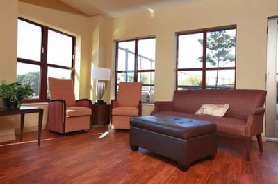 Bright common area with comfortable seating and natural light