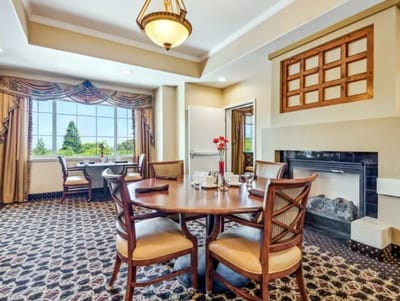 Dining area with elegant table settings and natural light