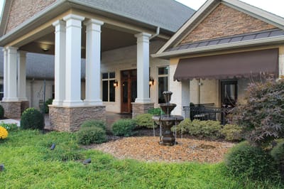 Exterior view of the facility with a fountain