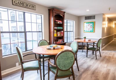 Interior view of a game room with tables and chairs