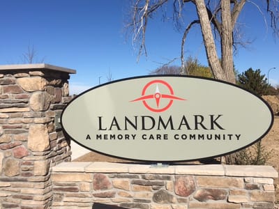 Landmark Memory Care community logo on a sign