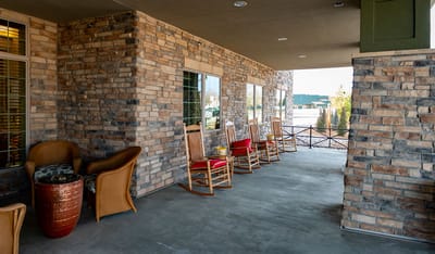 Covered outdoor seating area with rocking chairs
