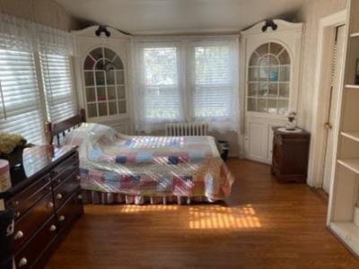 Cozy resident room with a bed and furniture