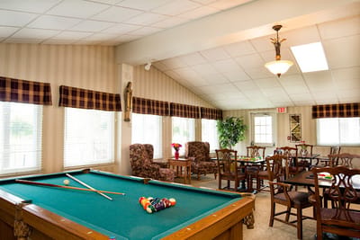 Interior view of a recreation room with a pool table