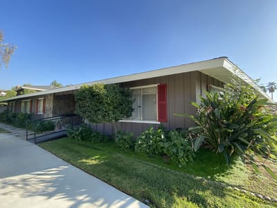 Exterior view of a senior care facility with landscaping