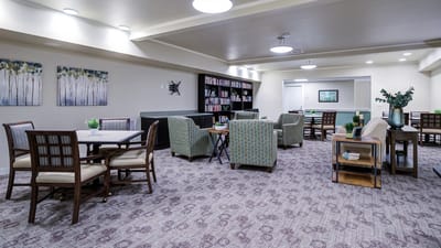Interior common area with seating and bookshelves