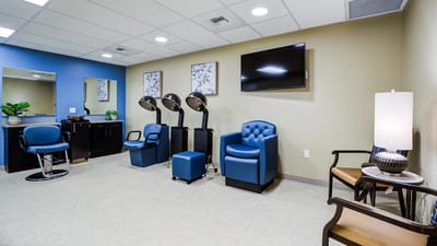 Well-lit hair salon area in a senior living community