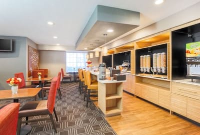 Bright dining room with colorful seating and food dispensers
