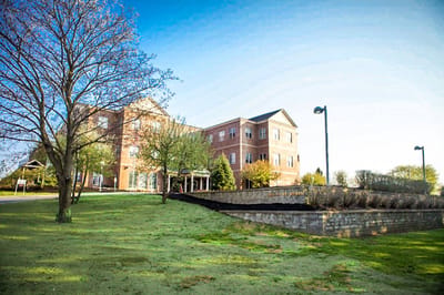Building exterior of Mount Joseph at Waterville with greenery