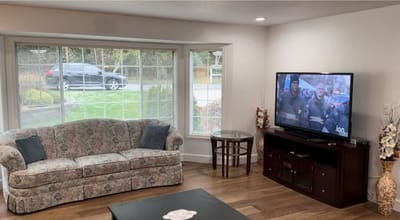 Comfortable sitting area in the living room with TV