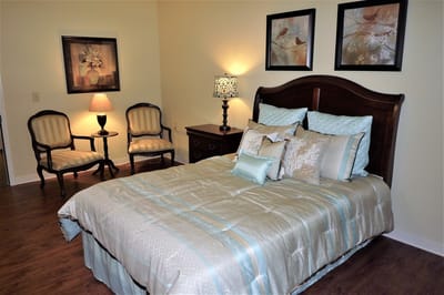 A well-furnished private resident room with decor
