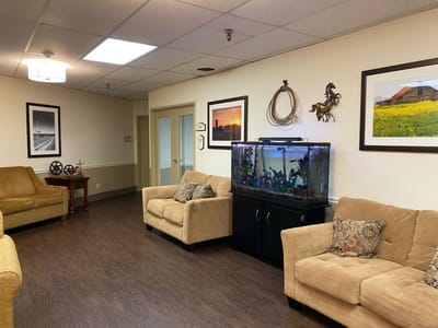 Interior common area with seating and an aquarium